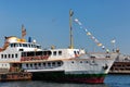 ISTANBUL, TURKEY - JULY 05, 2018: Small cruise ship Kalamis moored in Eminonu pier in Golden Horn bay of the Istanbul Royalty Free Stock Photo