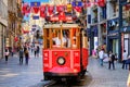 Istanbul, Turkey - July 18, 2019, The Taksim Tunel Nostalgia. Tram trundles along the istiklal street and people at