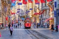 Istanbul, Turkey - July 18, 2019, The Taksim Tunel Nostalgia. Tram trundles along the istiklal street and people at