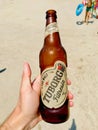 Istanbul, Turkey - July 23, 2018: Tuborg Beer Bottle Holding with Hand at the Beach Royalty Free Stock Photo