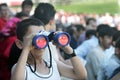 Horseracing fans watching the horse race Royalty Free Stock Photo