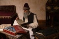 Istanbul, Turkey - June 18 2022: Artist performing calligraphy in Ottoman Turkish old Turkish