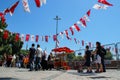 Kadikoy city center with a crowd of people and Turkish flags hanging on the ropes