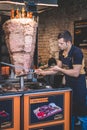 Istanbul, Turkey - June 6, 2020. Turkish man is preparing Doner Kebab in Kebab Bar.