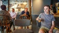 Istanbul, Turkey - June 02, 2017: Young man at Starbucks coffee shop in Istanbul. Royalty Free Stock Photo