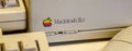 Istanbul, Turkey, March 2019: Closeup old rainbow Apple logo on old Macintosh computer. Rahmi Koc museum