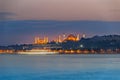 The Hagia Sophia and Suleymaniye Mosque at blue evening with ship trace