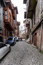 ISTANBUL, TURKEY - MARCH 23, 2023: Street with old traditional residential houses and filigree sidewalk