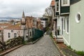 ISTANBUL, TURKEY - MARCH 23, 2023: Street with old traditional residential houses and filigree sidewalk