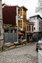 ISTANBUL, TURKEY - MARCH 23, 2023: Street with old traditional residential houses and filigree sidewalk