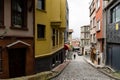 ISTANBUL, TURKEY - MARCH 23, 2023: Street with old traditional residential houses and filigree sidewalk