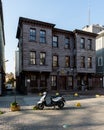 ISTANBUL, TURKEY - MARCH 25, 2023: wooden historic building on Istanbul street home and motorcycle Royalty Free Stock Photo