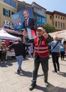 Man waving big poster of Kemal Kilicdaroglu photo in front of Republican Peoples Party kiosk, Ortakoy, Istanbul, Turkey