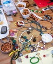 Istanbul, Turkey - May 16, 2016: The process of creating jewelry with wire, beads and crystals. Working tools on the table.