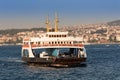 Ferry boat carrying cars between the two sides of the Bosphorus canal Royalty Free Stock Photo