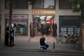 Man using a smartphone mobile phone in front of a store in the center of Istanbul. Royalty Free Stock Photo