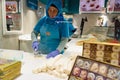 Istanbul, Turkey - 15 May 2023: a woman is seen preparing traditional turkish delight sweet inside a bakery. Turkey is famous for