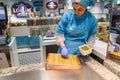 Istanbul, Turkey - 15 May 2023: a woman is seen preparing traditional turkish delight sweet inside a bakery. Turkey is famous for