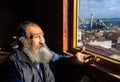 Istanbul, Turkey. 09-November-2018. Portrait of an old bearded Turkish man looking through the window