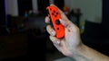 Red controller for Nintendo Switch - a handheld gaming console Royalty Free Stock Photo