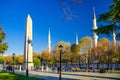 Sultan Ahmed Mosque Blue Mosque with minarets, Obelisk of Theodosius Dikilitas and tourists walking down pedestrian street Royalty Free Stock Photo