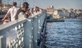 ISTANBUL, TURKEY - OCT. 09: Fishermen on Galata bridge of Istambul on oct, 09, 2013 in Istanbul, Turkey. Galata Bridge is Royalty Free Stock Photo