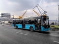 Blue city bus on Ataturk Bridge in Istanbul. Public transport on a city street on a cloudy Royalty Free Stock Photo