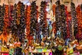 Picturesque view of Egyptian Market Spice Bazaar. Dried vegetables hanging vertical and metal turkish turks