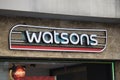 The sign of the Watsons brand hangs in the building. A photo was taken outside on the street. Cosmetic and personal care brand Royalty Free Stock Photo