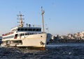 Turkish Ferry aka Vapur arriving to Eminonu Pier near Galata Bridge in Istanbul