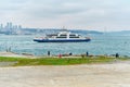 Passenger ferry and ship in istanbul bosphorus during cloudy and overcast weather