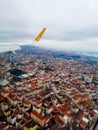 A Pegasus airline plane comes in for landing in Istanbul among clouds at altitude close up of its