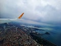 A Pegasus airline plane comes in for landing in Istanbul among clouds at altitude close up of its