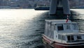 Istanbul, Turkey - 1.14.2023: Boat waving under Golden Horn bridge