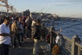 ISTANBUL / TURKEY - 30/05/2015: a regular daily gathering of a large crowd of turkish male fishermen for favorite hobby evening Royalty Free Stock Photo