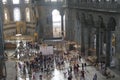 Tourists explore the vast interior of Hagia Sophia