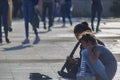 Istanbul, Turkey - September-14,2019:Artist girl performing music on the street. Pulled to his left. People walking around