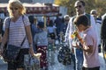 Istanbul, Turkey - September-28,2019: Child selling bubble machine on the street and little soap bubbles around. Blurred people