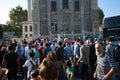 Crowd of people on the road on pedestrian near mosque