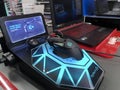 Logitech G502 Hero gaming mouse inside an electronic store on a stand