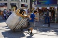 Man carrying merchandise in the middle of the street