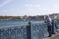 Istanbul, Turkey - September-11..2019: Man fishing on the Galata Bridge. Hagia Sophia and sea on the background. Royalty Free Stock Photo