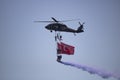 Istanbul, Turkey - September-18,2019: Soldier doing demonstration flight under helicopter. Turkish land forces
