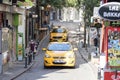 Two taxi cars on a narrow street Royalty Free Stock Photo