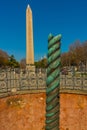 ISTANBUL, TURKEY: Snake Column and Egyptian Obelisk in Sultanahmet Square