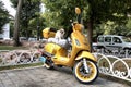 Istanbul Turkey sunny day, yellow moto bike scooter relaxed street cat Royalty Free Stock Photo
