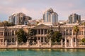 ISTANBUL, TURKEY - 09 07 2020: Sunset view on the bank of Bosporus Strait with Dolmabahce Palace, a museum in ornate