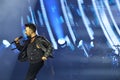 24-01-2026 Istanbul Turkey: Tarkan performing live on stage under blue concert light Royalty Free Stock Photo
