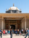 Istanbul / Turkey Tour guide raising hand, tourists, visitors at Topkapi palace inner yard