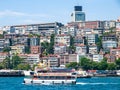 Istanbul / Turkey Touristic cruise ship with passengers at Bosporus strait. Residential buildings at coast in the background